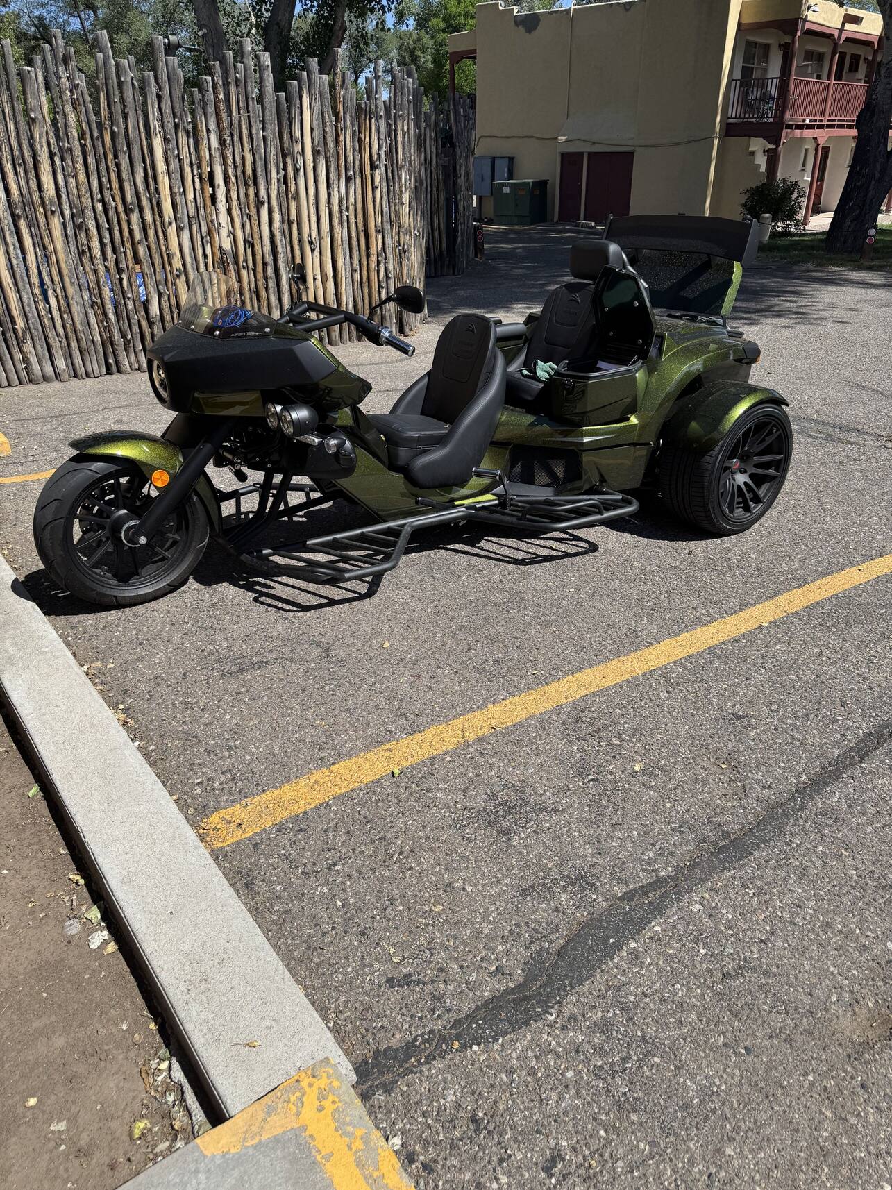 Rewaco trike parked by a wooden fence in New Mexico