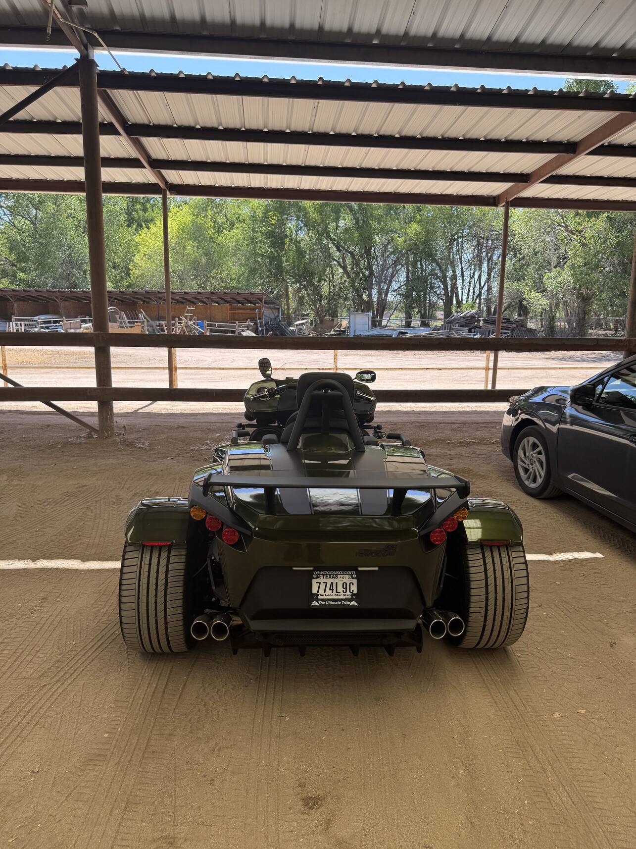 Rear of the Rewaco trike under a covered carport